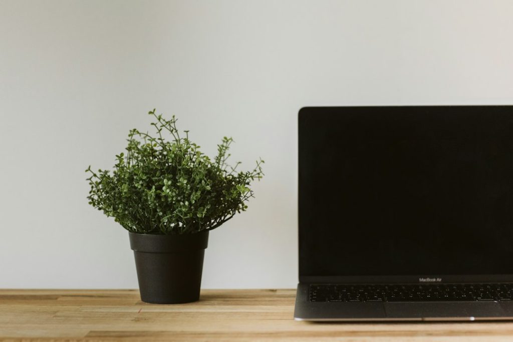 Bright modern workspace with a laptop on a desk